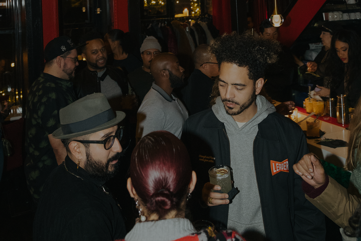 People drinking at happy hour event in Chez Messy